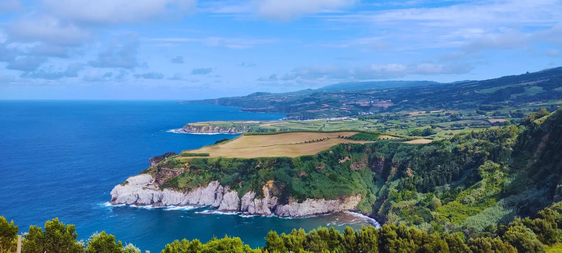 The view of different capes along the coast of an island.